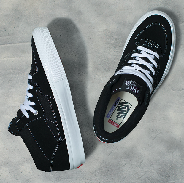 Half white top half black vans